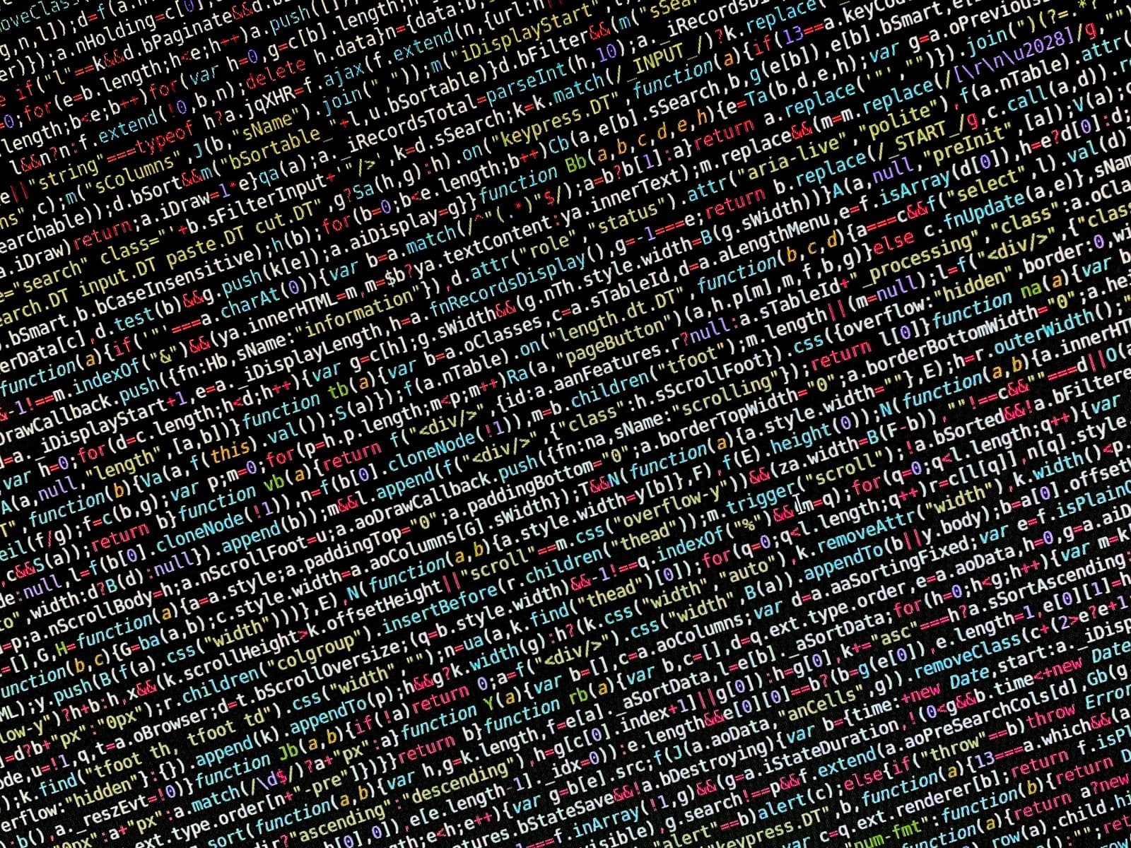 Close-up of a screen displaying colourful, syntax-highlighted programming code against a dark editor background.